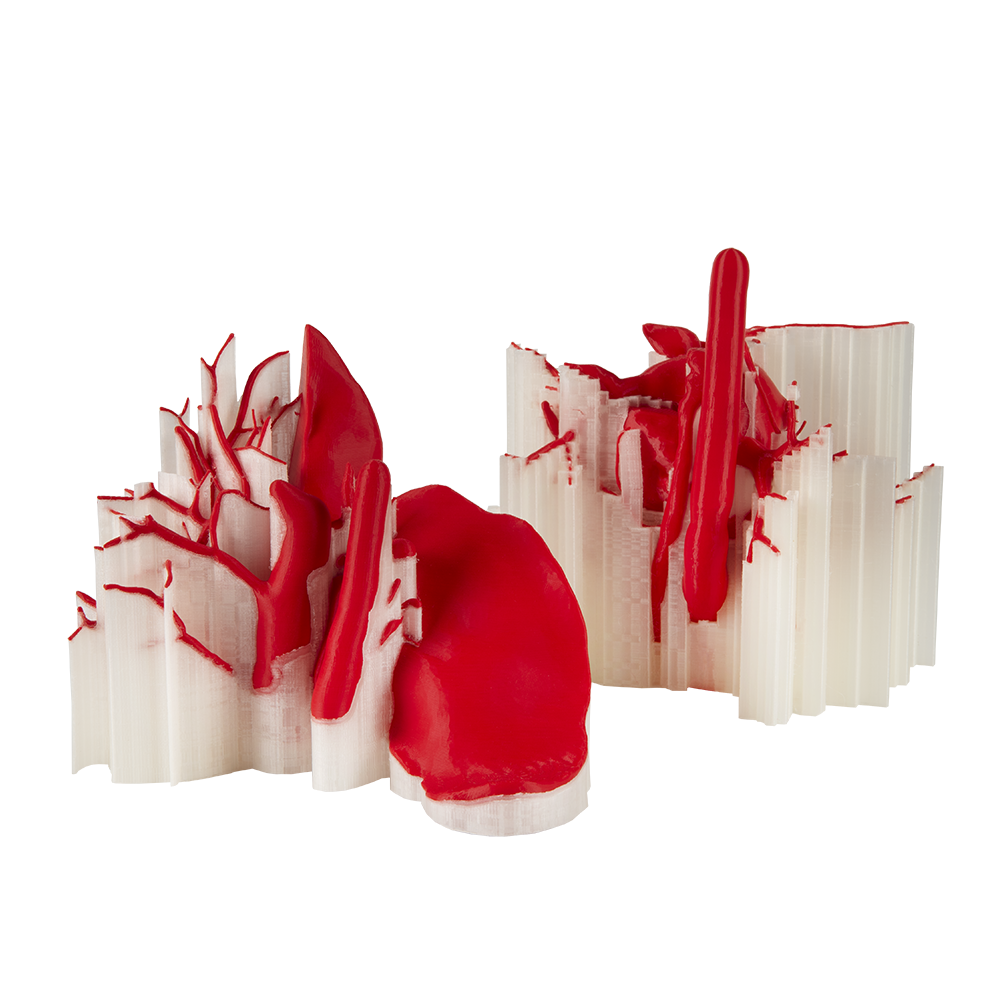 Red and white abstract 3D printed models with intricate designs created by Prusa XL, showcasing the printer's precision and capability.
