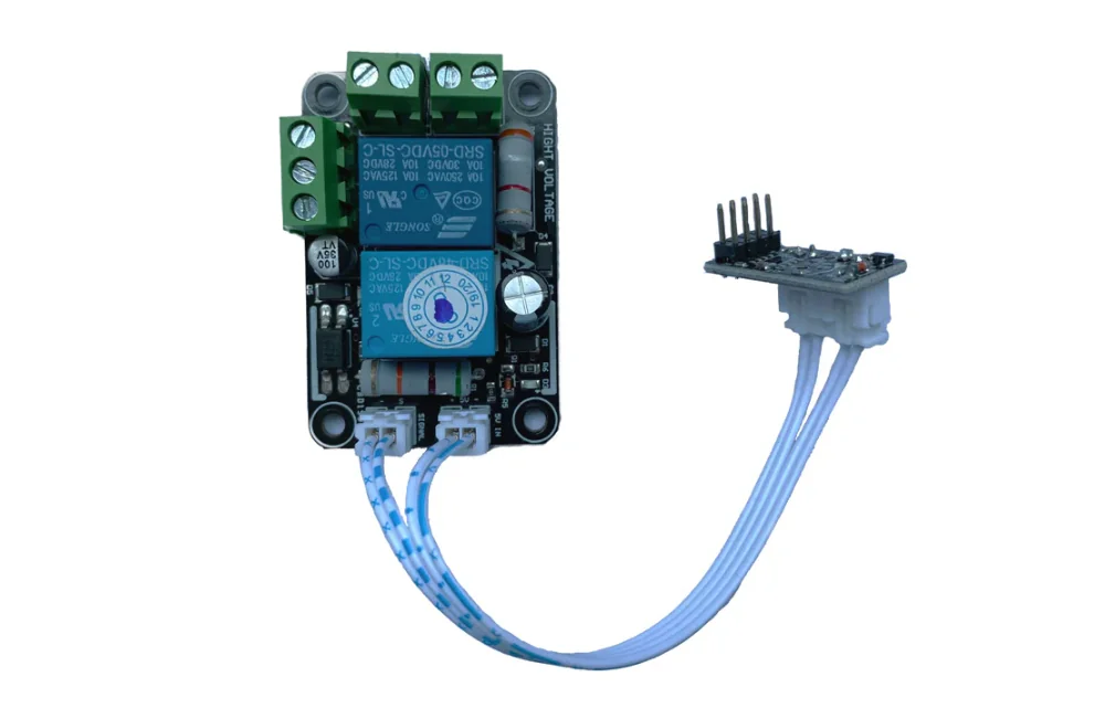 Relay control board with blue wires and green terminal blocks, used in the Qidi i-Fast 3D printer for precision component manufacturing.