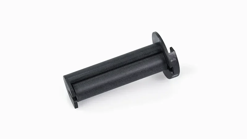 Black cylindrical part created by Raise3D E2 3D printer, featuring a flanged base and a smooth matte finish, on a white background.