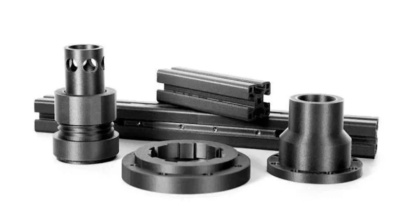 Raise3D E2CF-produced black 3D-printed components, including cylindrical and linear parts, displayed on a white background.