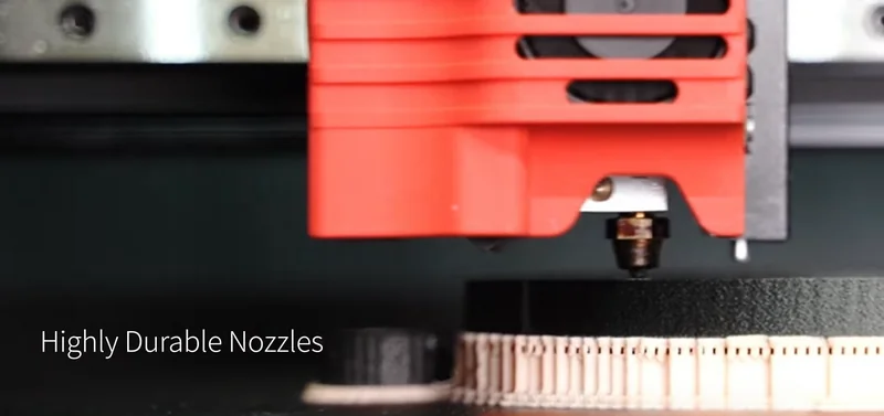 Raise3D E2CF printing with durable nozzles, creating detailed black and beige parts.