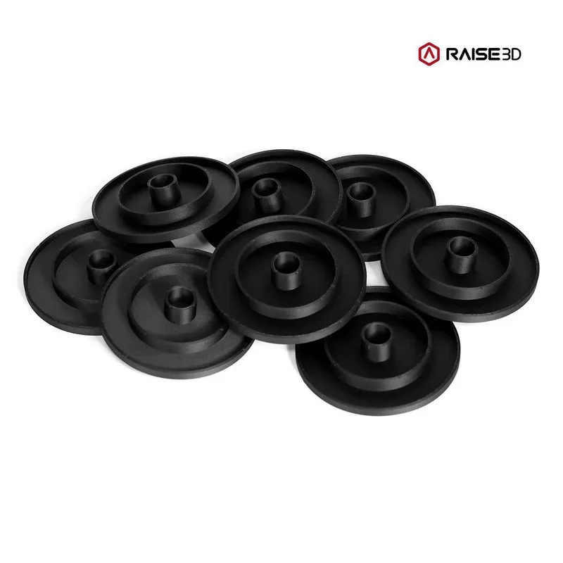 Black printed components in a circular design by Raise3D E2CF, arranged in a pile, with Raise3D branding in the corner.