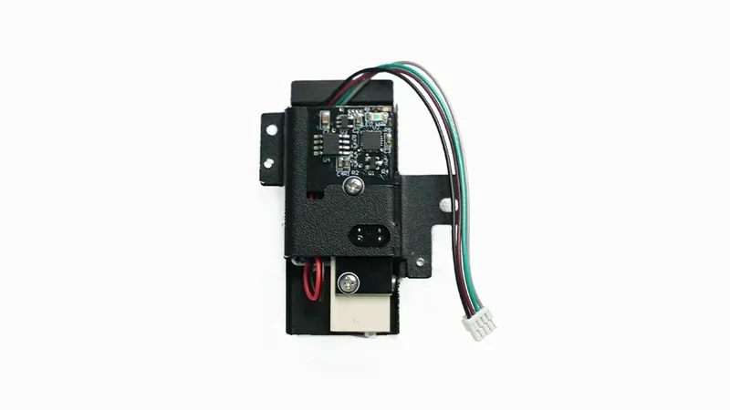 raise3d e2cf printer component, featuring circuit board and wiring, likely created by the 3D printer, set against a plain white background.