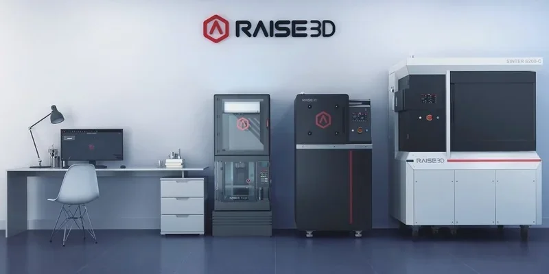 Raise3D MetalFuse setup in a sleek lab with branding; includes computer workstation and 3D printer likely producing sample parts.