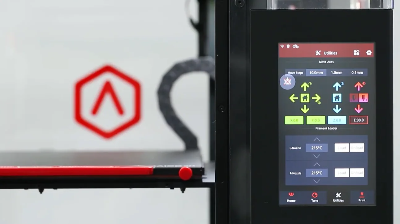 Touchscreen panel of Raise3D Pro2 Plus 3D printer showing controls, beside a red logo, indicating precision printing capabilities.