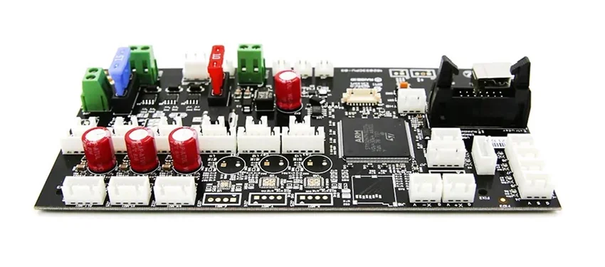 Raise3D Pro2 Plus circuit board with red capacitors, colored connectors, and a central microcontroller, showcasing essential components.