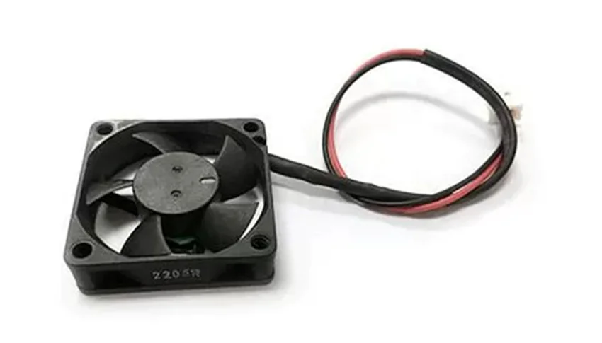 Fan component for Raise3D Pro2 Plus 3D printer, with black blades and red-black wires, likely used for cooling during 3D printing process.