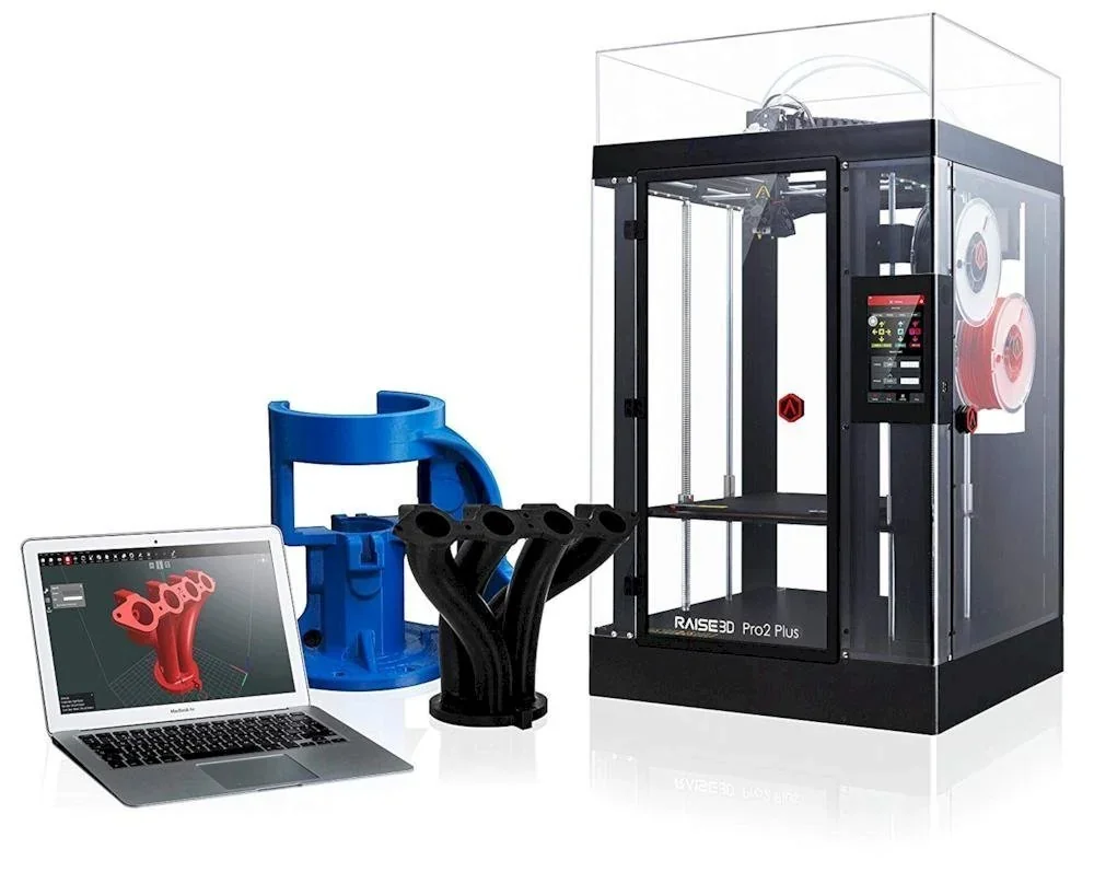 Raise3D Pro2 Plus 3D printer with laptop displaying design, black and blue printed parts. High-tech, precise manufacturing with visible branding.
