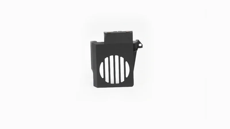 Black 3D printed part with vertical slits, created by Raise3D Pro3 printer, on a plain white background.