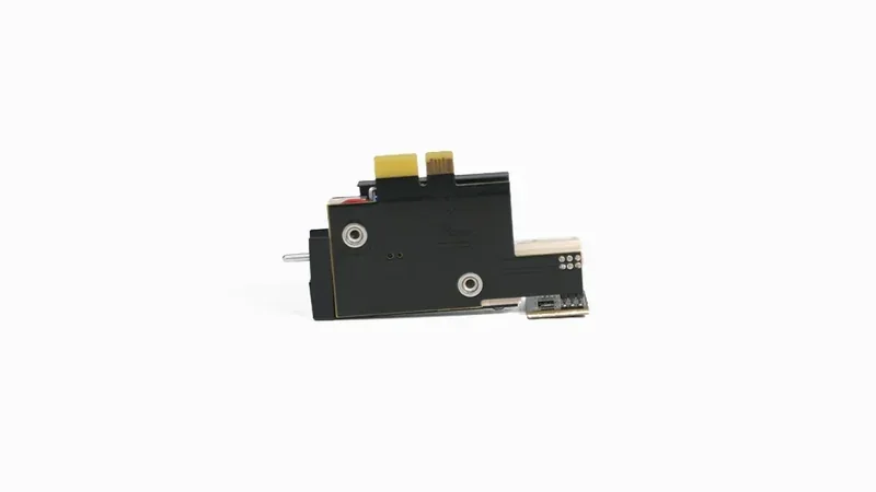 Black and yellow component of the Raise3D Pro3 3D printer, essential for precise printing, isolated on a white background.