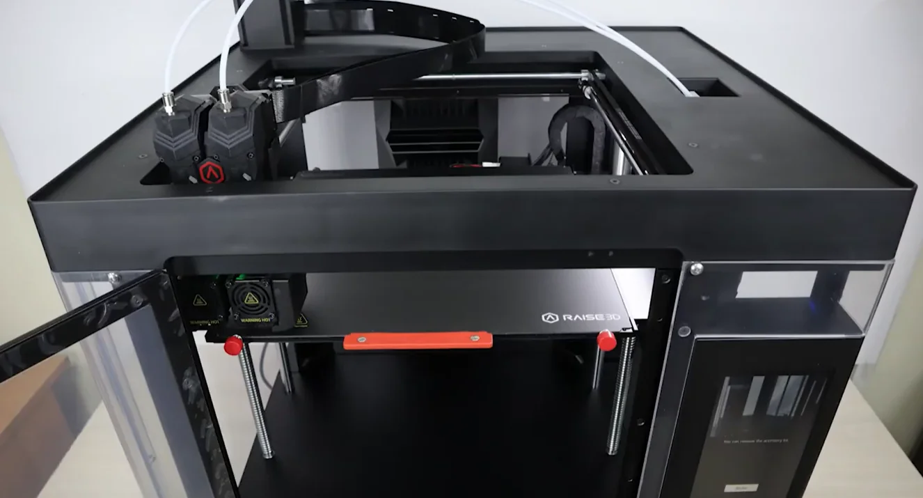 Raise3D Pro3 HS 3D printer with open top and dual extruders, featuring a clear door and Raise3D branding, designed for creating detailed parts.