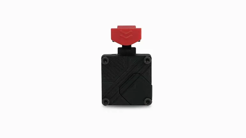 Black 3D printed component with a red attachment, created by Raise3D Pro3 Plus, on a white background.