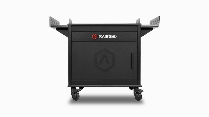 The image shows a black rolling cabinet branded "RAISE3D," designed for 3D printing storage or support, possibly for the Raise3D Pro3 Plus HS. It has a door with subtle branding in the center and features caster wheels for mobility, as well as side handles for easy maneuvering.