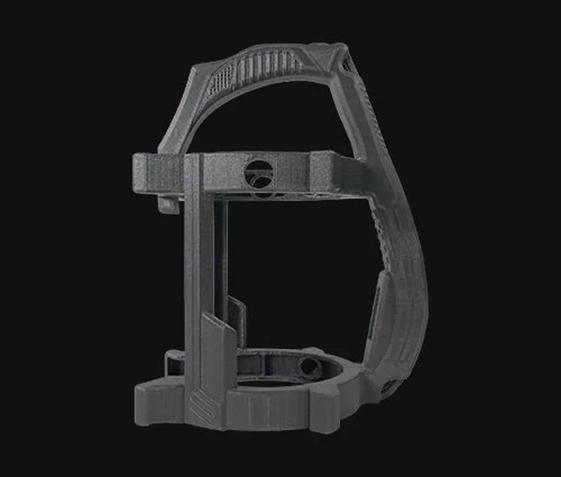 Intricate gray 3D-printed part with arches and holes, designed by raise3d rmf500, set against a black background.