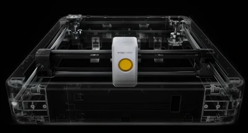 Transparent Snapmaker u1 3D printer showcasing internal components, featuring sleek design on a dark background.