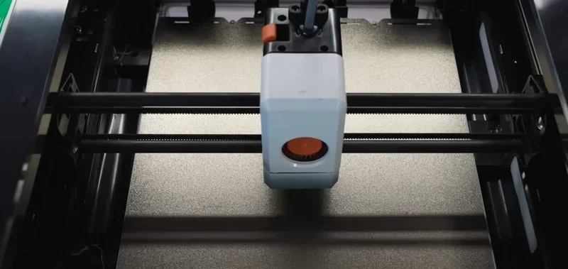 Snapmaker U1 3D printer interior showing print head and rails, focused on precise mechanics; image lacks branding but highlights innovative design.