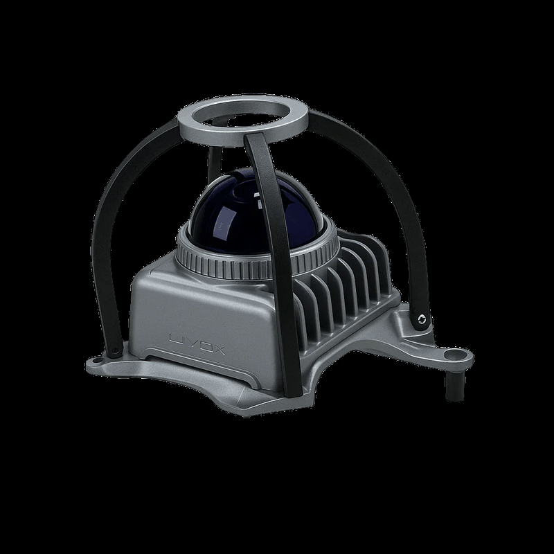 The image showcases a compact, modern sensor component with a sleek gray housing and black protective brackets arching over it. The hemispherical glass dome, possibly a LiDAR sensor, sits atop a ribbed base designed for heat dissipation. The word "LiVOX" is embossed on the side, indicating the branding. The design suggests it might be part of a higher-tech system, potentially used in robotics or autonomous devices.