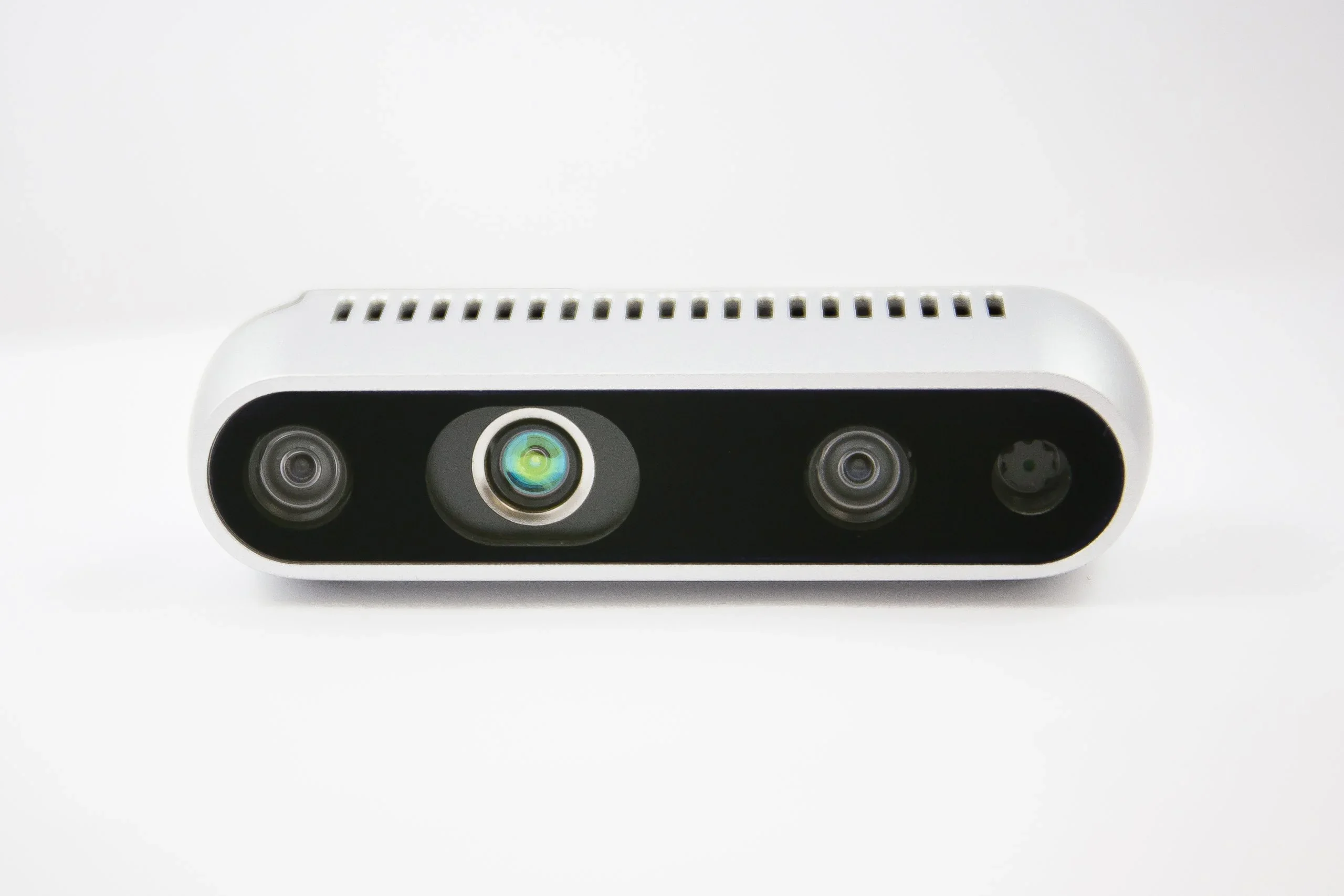Unitree G1 sensor module with three lenses in a sleek, rectangular casing on a white background, designed for robotic navigation and object detection.