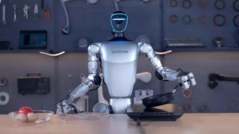 Unitree G1 humanoid robot in a workshop, holding a frying pan with tools and a bowl of eggs nearby, displaying advanced dexterity and function.