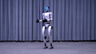 Unitree H1 humanoid robot standing in front of curtains, showcasing its mobility with LED face display and tethered green cable.