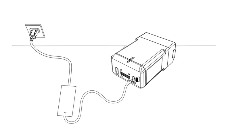 Unitree H1 power supply unit diagram showing a connected cable plugged into a wall socket, indicating charging setup and functionality.