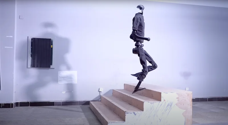 Unitree H1 humanoid robot ascending stairs in an indoor setting, showcasing agility and stability; emphasizes innovative robotic movement capabilities.